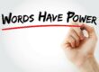 A hand writing "Words have power," underlined in red.